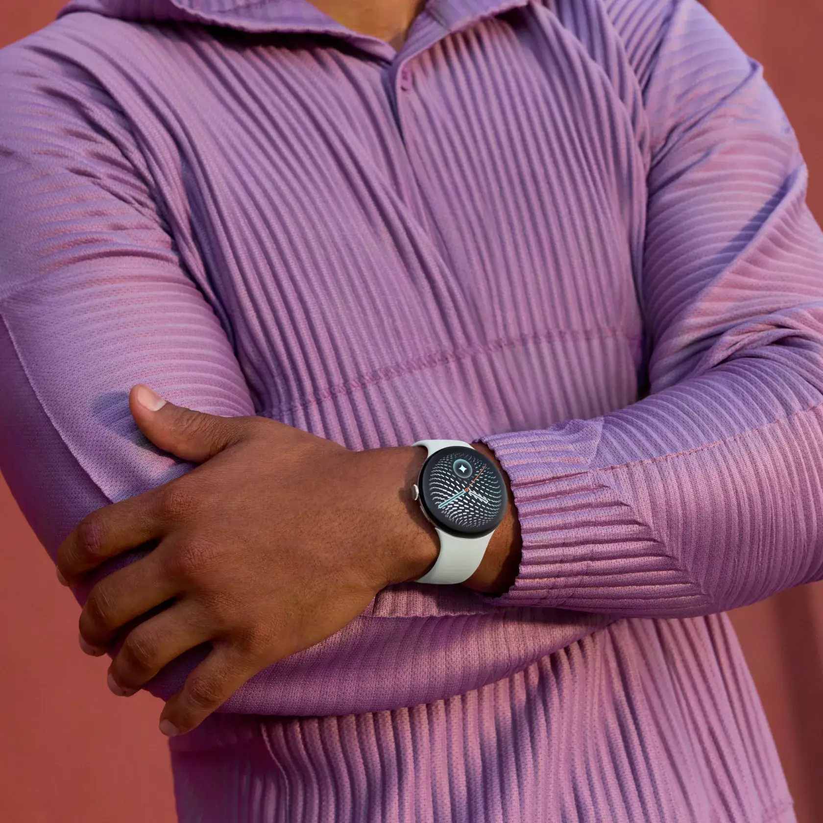 Image of person with arms crossed wearing Google Pixel Watch 5