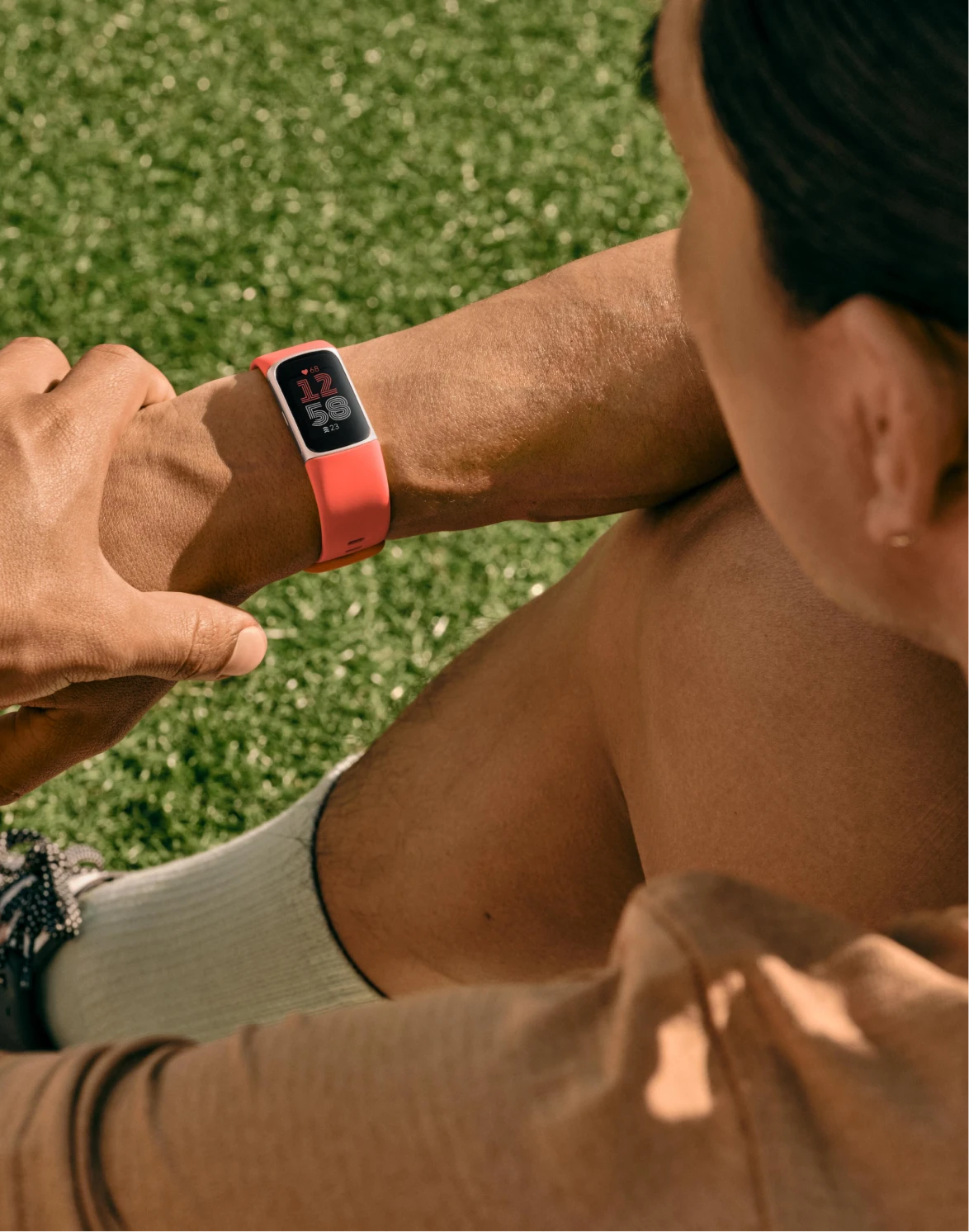 Image of man resting after workout wearing Fitbit Charge 6. 