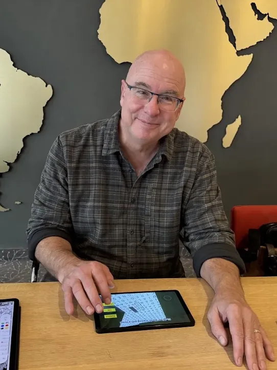 David L. Hoyt, aka “the world’s most-syndicated daily word game creator,” works on one of Hoyt Games’ free-to-play puzzle apps.