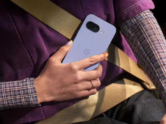 Woman on the go holding an Android smartphone