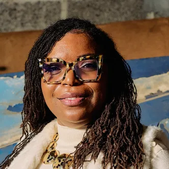 A photograph of Natasha Broxton, CEO of Auto Select Parts & Sales, an indoor used auto parts recycler based in Milwaukee, Wisconsin.