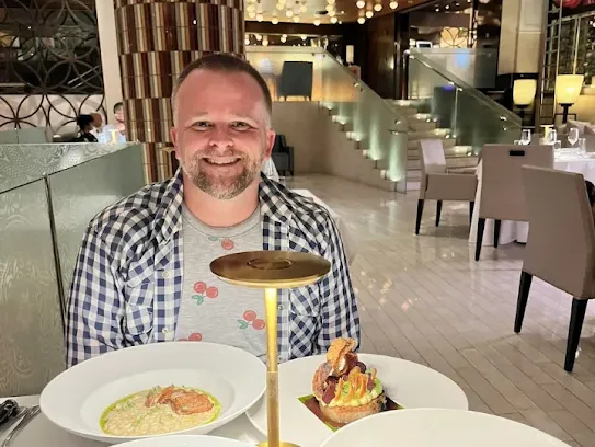 Andrew enjoying a good meal