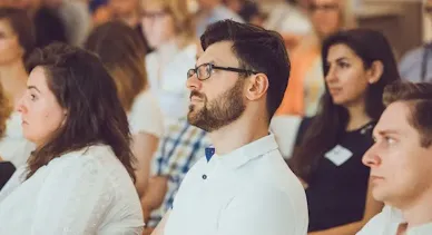 A man paying attention to someone