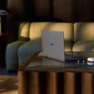 Googlebook on a coffee table in a living room setting.