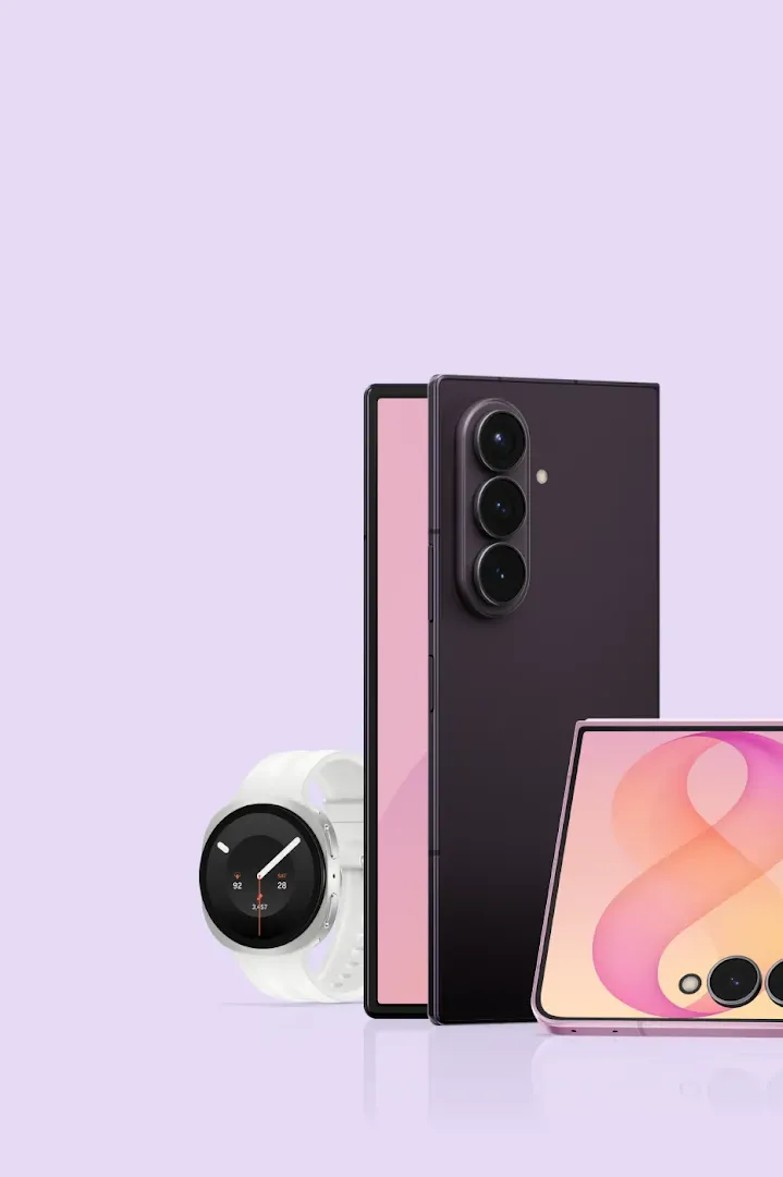 Samsung Galaxy devices appear in front of a light purple background. A black galaxy watch sits next to a Galaxy Z Fold8 phone, A Galaxy Z Flip Phone, and a Samsung S24 Galaxy Ultra. 