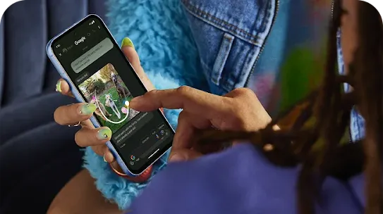 Woman holding Android phone using Circle to Search feature