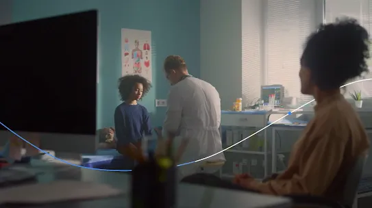 doctor treating a child with a parent looking on
