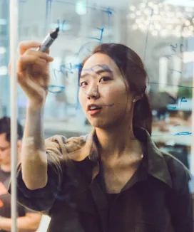 Woman chatting with a man, smiling.