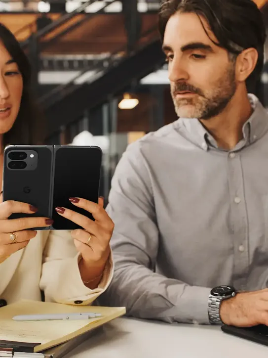 Image of a woman using her phone at a cafe