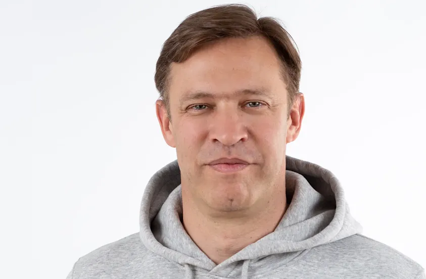 Portrait of the quote's author wearing a hoodie.