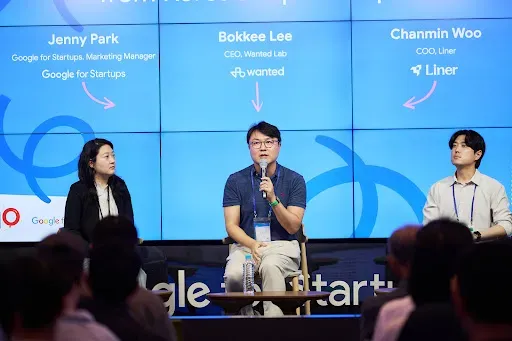 Wanted Lab co-founder Bok-Gi Lee in the center speaking on a panel with two other people at the 10 year anniversary celebrations of Google Campus Seoul.