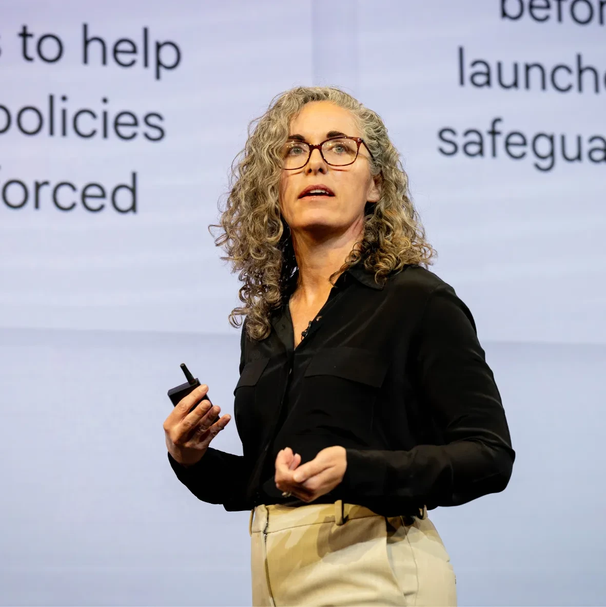 A person speaking on a stage