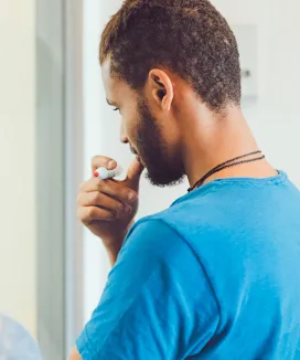 A man in blue T-shirt.
