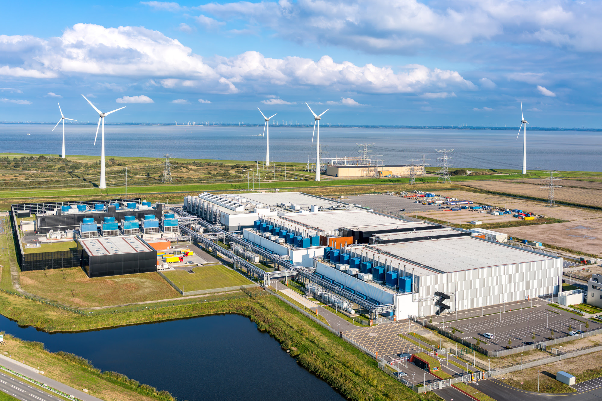 A European Google data center with wind turbines in the background