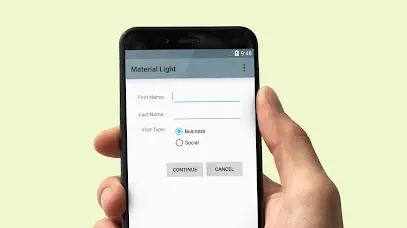 A hand holding a smartphone displaying a "Material Light" visitor registration form.