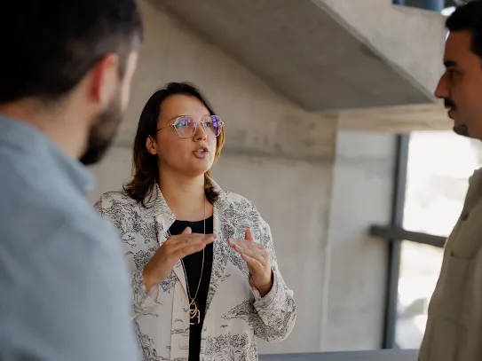 Three people talking to each other