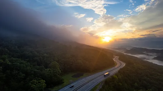 Aerial view of winding highway through rolling hills 