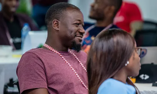 A smiling man with beard.