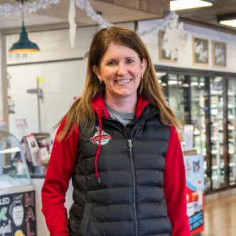 A photograph of Jordan Hansen, co-owner of Hansen’s Dairy, a seventh-generation farm in Hudson, Iowa.