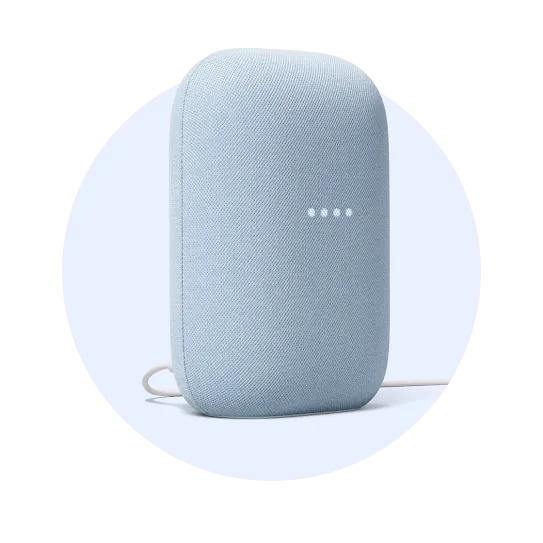 A light gray smart speaker with indicator lights on the front, connected by a power cord.