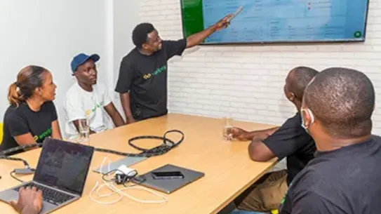 Workpay team is in conference room and one colleague is giving presentation.