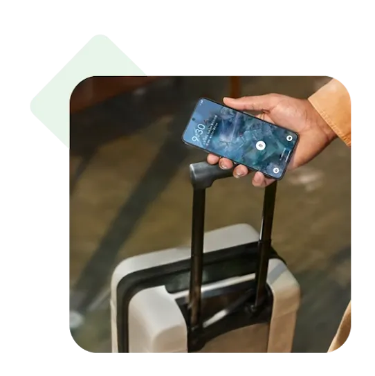 A person's hand holding a smartphone displaying security features.