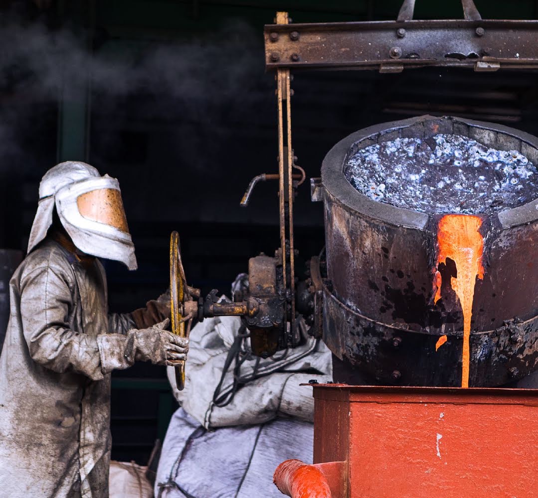Staff at LuNa Smelter in Kigali, Rwanda, process ore into ingots of tin