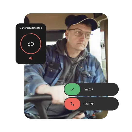 A truck driver is sitting behind the steering wheel. On the top left there is an animated overlay with a notification saying car crash detected, along with a 60 second countdown clock. And on the bottom right side there is a UI animation with options I’m OK and call 911.