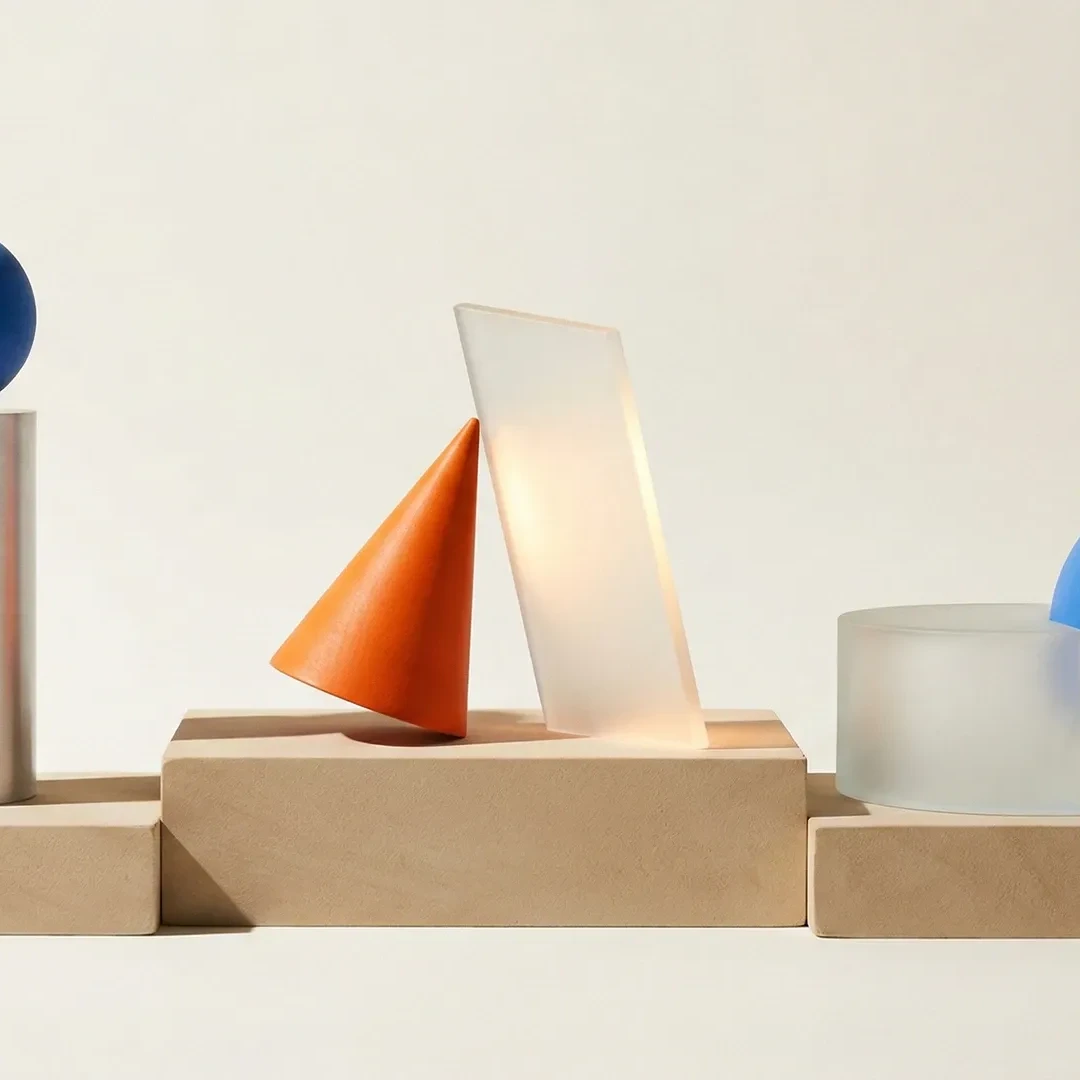Geometric shapes resting on top of wooden blocks