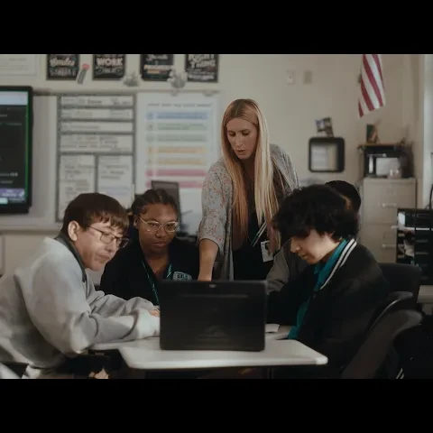 A YouTube thumbail showing a teacher teaching students in a classroom setting