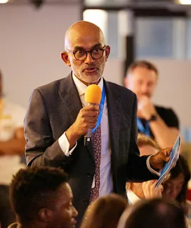 A man holding the mic in hand