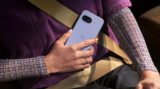 Woman on the go holding an Android smartphone