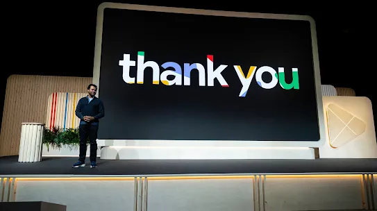Play's VP & GM, Sam Bright stands on-stage at the Playtime event in front of a presentation screen that says "Thank you"