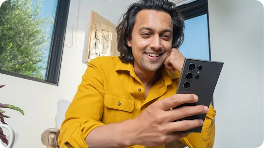 Image of a man using his Android-powered device 