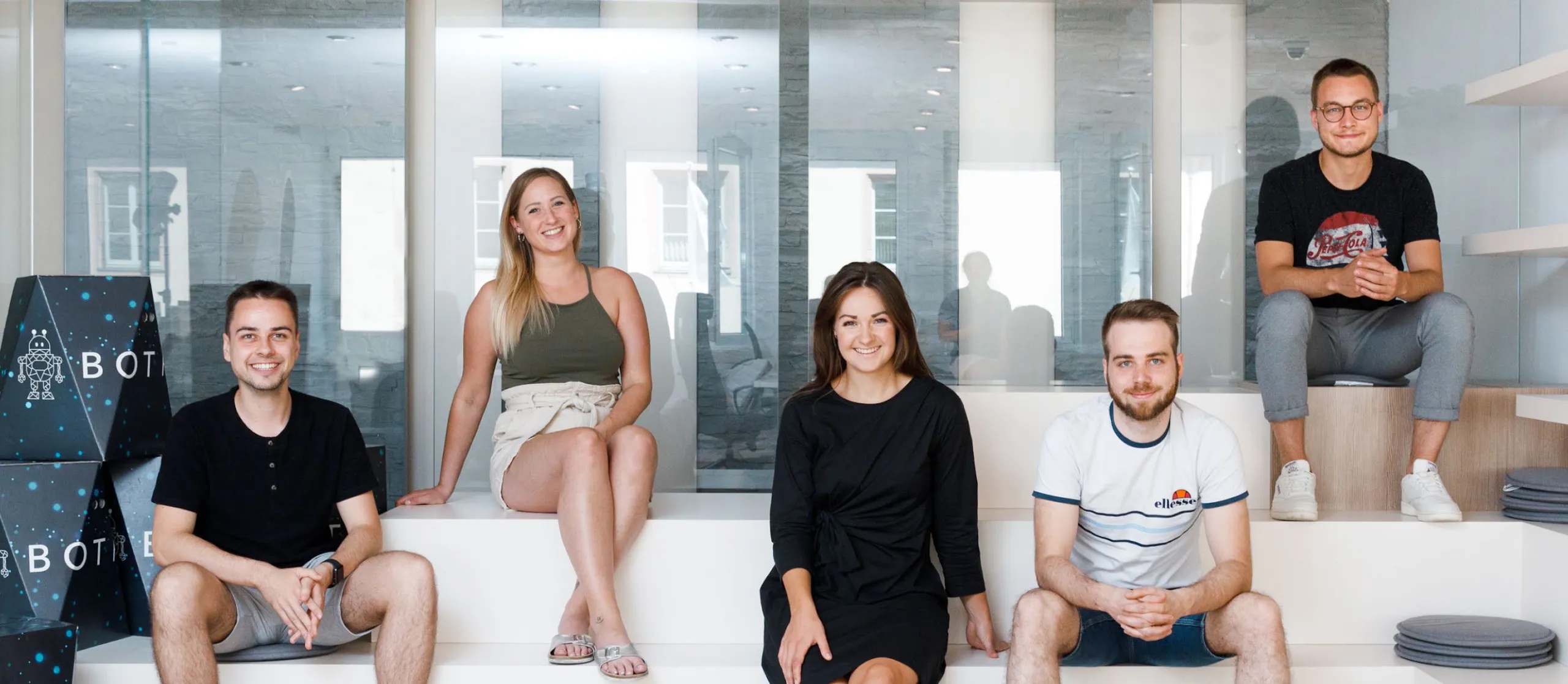 a group of people smiling at the camera