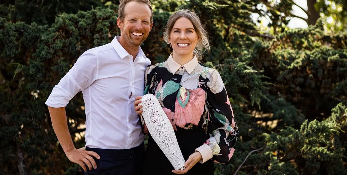 Emelie and Christian, co-founders of Anatomic Studios, looking at the camera and smiling while holding the prosthesis they designed.