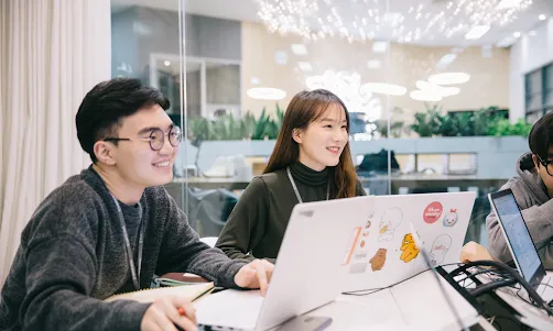 two people in meeting looking for same thing