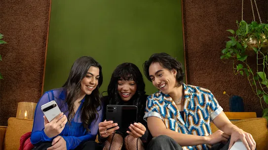 People sitting together holding their Android devices