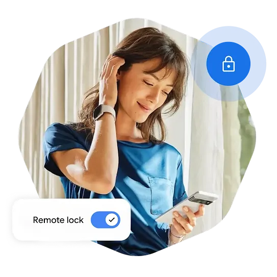 A woman wearing a smartwatch and standing in front of a window with curtains brushes her hair behind her ear and looks down at her phone in hand.