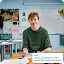 A portrait of an educator named Eric in a classroom, identified as a "Google Generative AI for Educators Course Graduate.