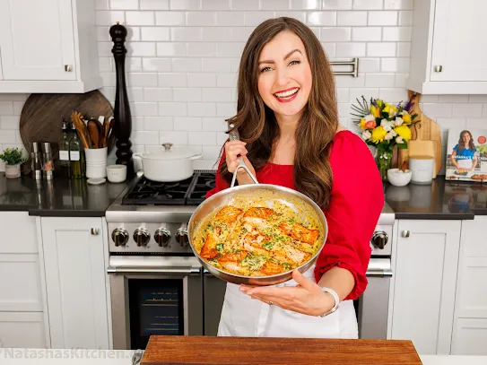 Natasha holding up a pan.