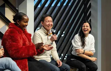 A person from the group is addressing the others with a mic.