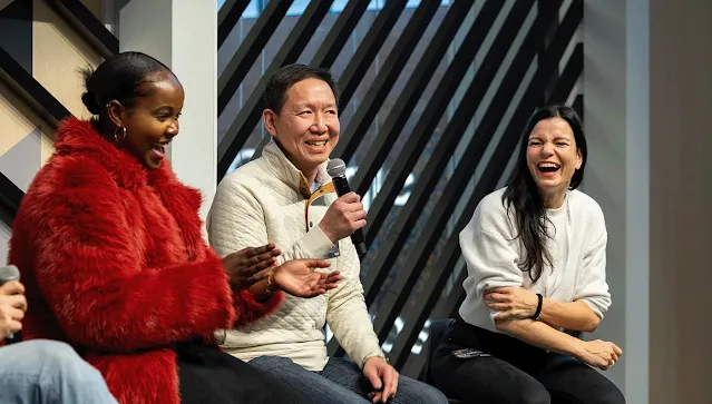 A person from the group is addressing the others with a mic.