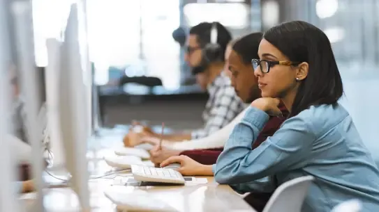 students working at a library’s computer lab