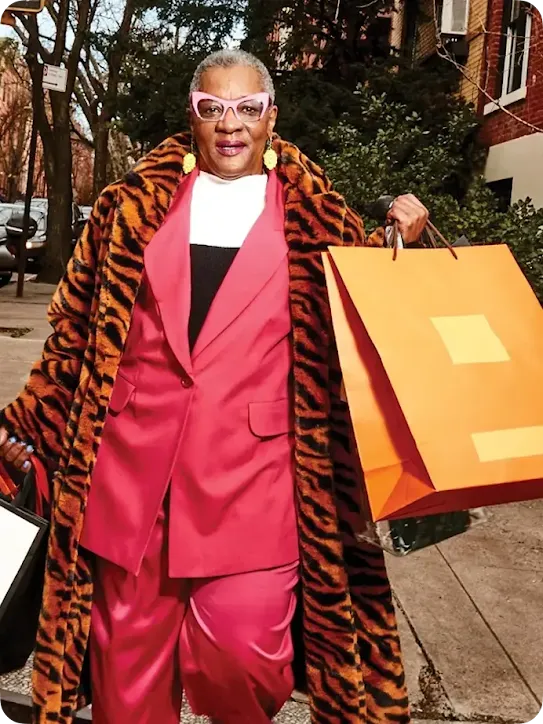 person holding many shopping bags