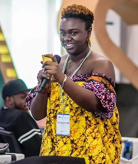 The female host, with a mic in hand, is delivering an excellent event.