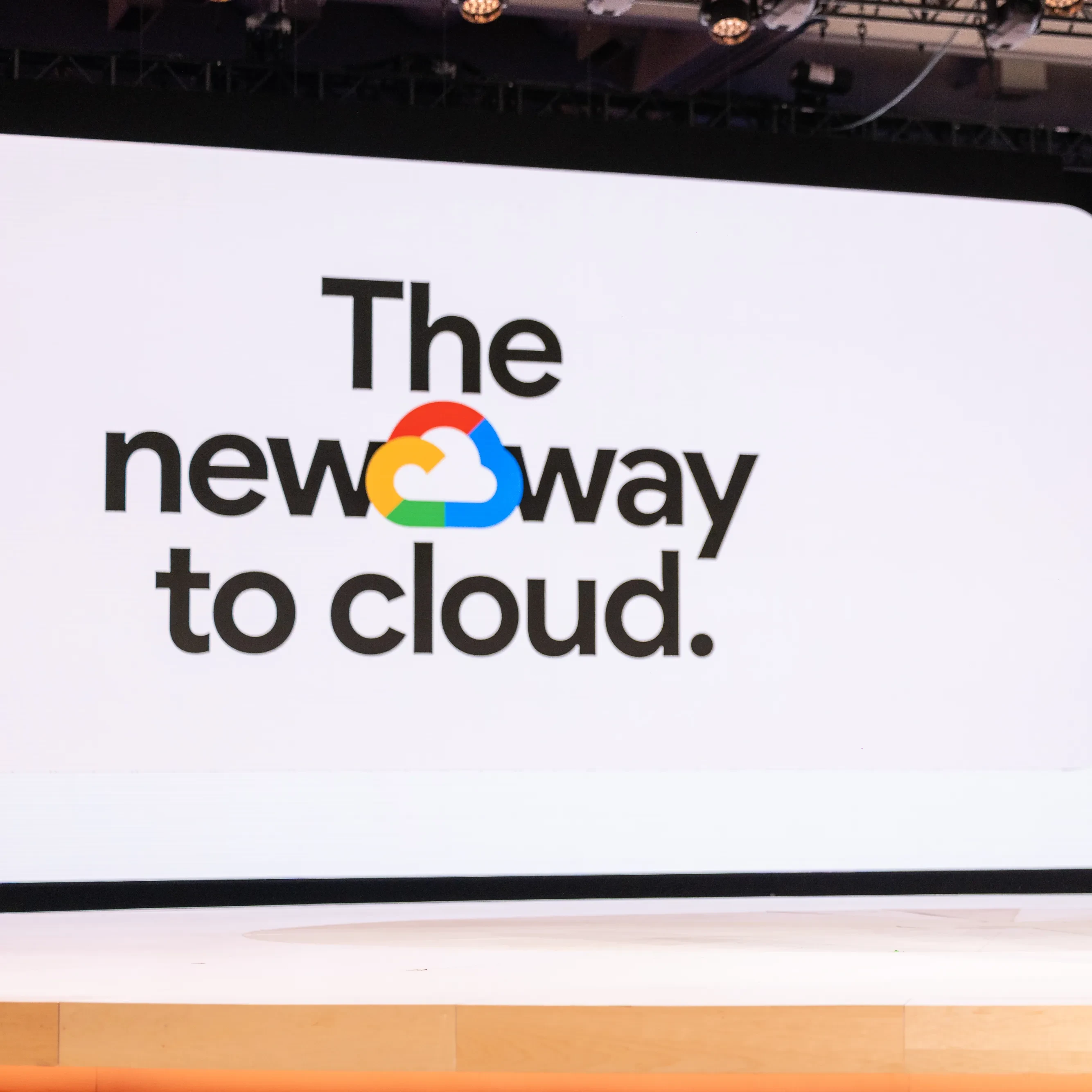 A person stands on stage at the Google Cloud event