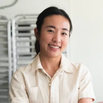 A photograph of Jamie Kim, the owner of Jamie’s Farm, an artisanal New York-based granola brand.