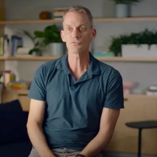 A thumbnail image of a YouTube video about calculating AI's energy impact, featuring Google Chief Scientist Jeff Dean