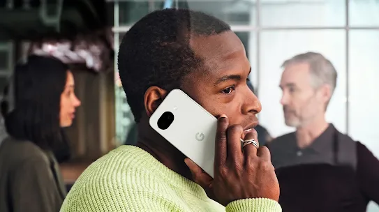 A man using his Android phone on a call. 